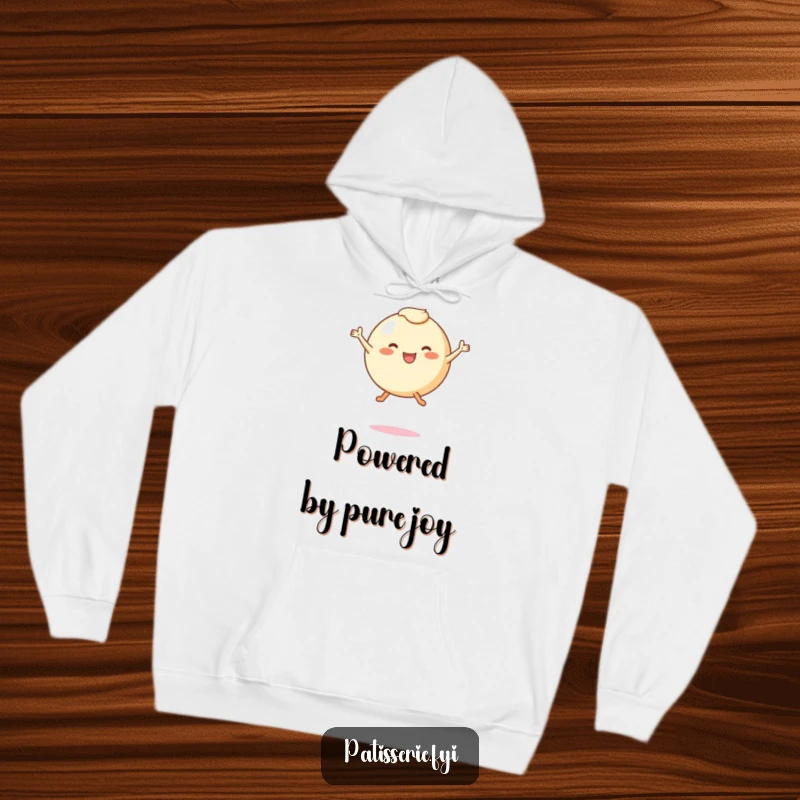 Funny hoodie featuring a round, leggy pastry character joyfully leaping mid-air, symbolizing carefree happiness and cozy comfort.
