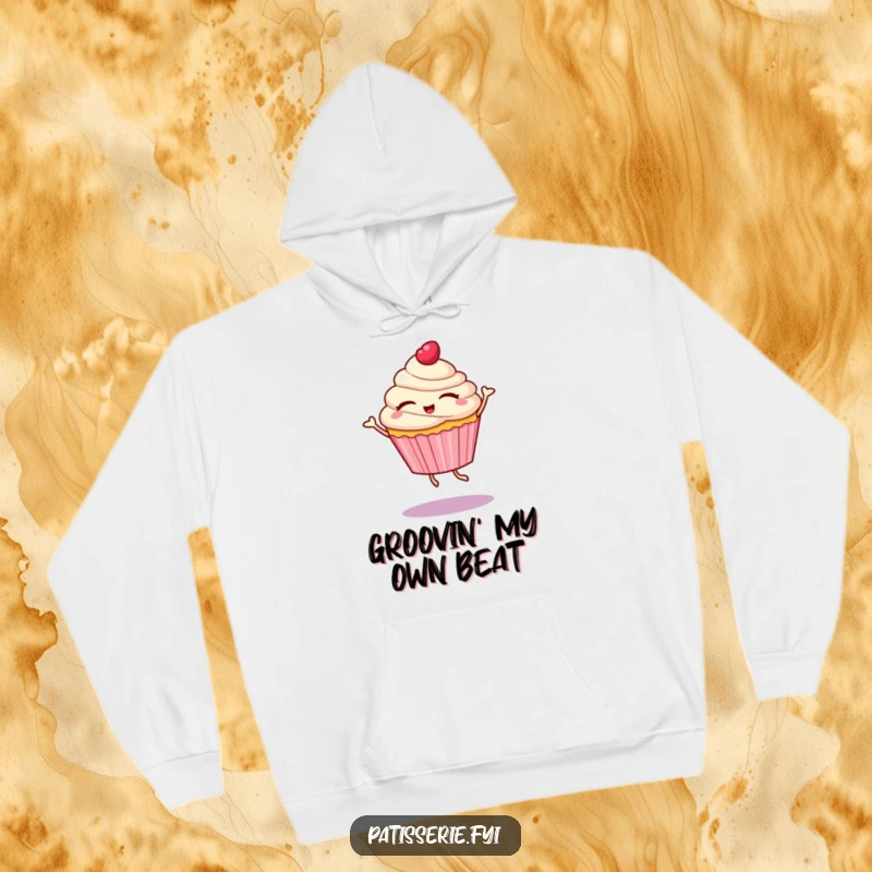 Funny hoodie featuring a cupcake character with eyes closed, spinning in a delightful dance, perfect for cozying up with sweet cheer.