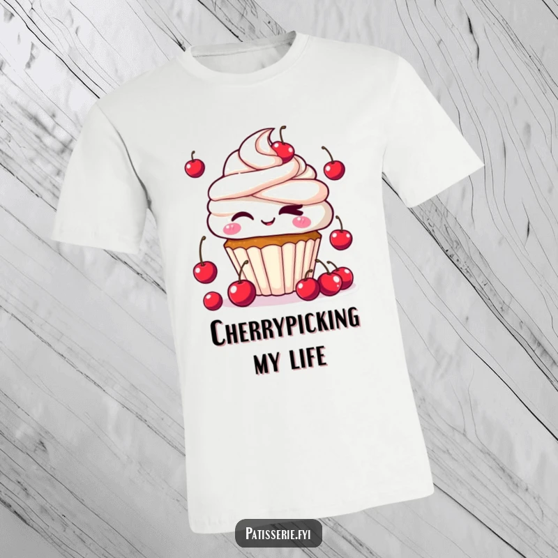 Funny Kawaii Cupcake T-Shirt showing a cute cupcake character winking mischievously while juggling cherries, a symbol of sweet fun.
