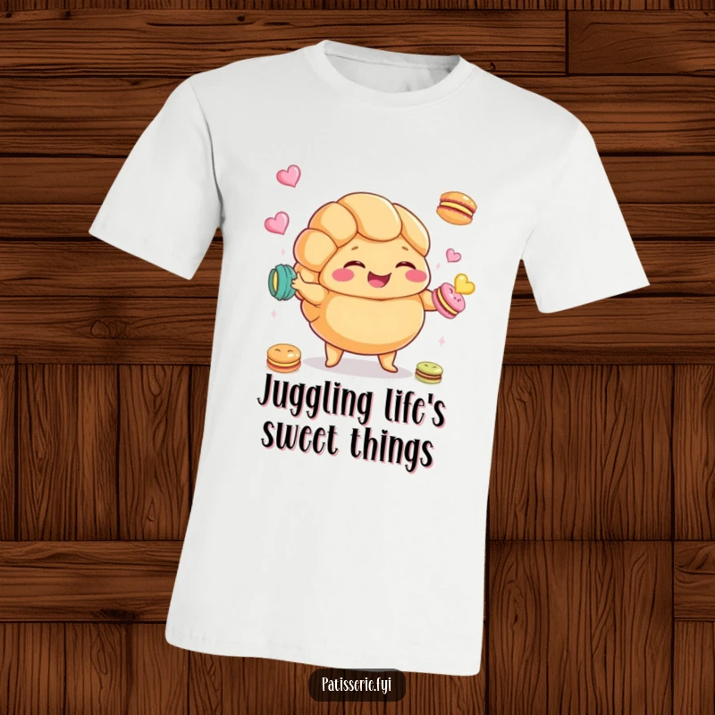 Funny Croissant T-Shirt depicting a plump croissant character giggling while juggling macarons, a humorous food design.